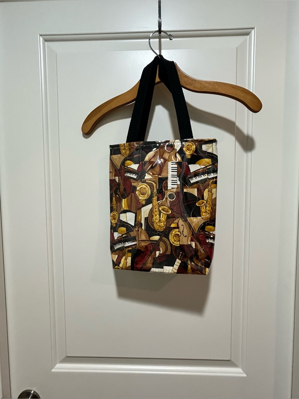 Musical Instruments Pattern Plastic coated Tote Bag in Brown and Gold. Like New